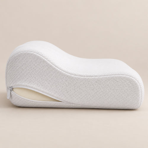 Side view of the contoured pillow with the cover zip open